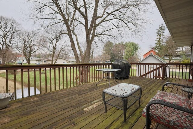 203 S Main St, Deerfield, WI 53531 - wooden deck featuring a yard, a residential view, and area for grilling