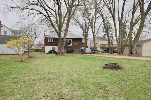 203 S Main St, Deerfield, WI 53531 - view of yard featuring a fire pit and a deck