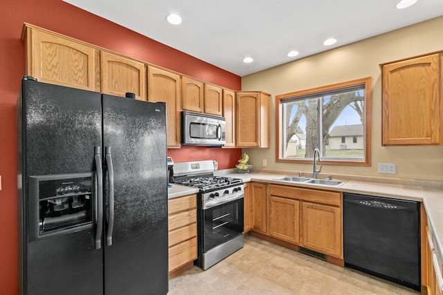 kitchen featuring a sink, visible vents, recessed lighting, light countertops, and black appliances