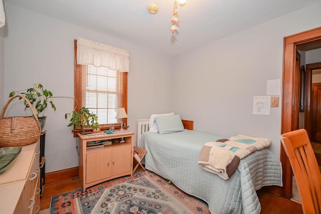 bedroom featuring wood finished floors