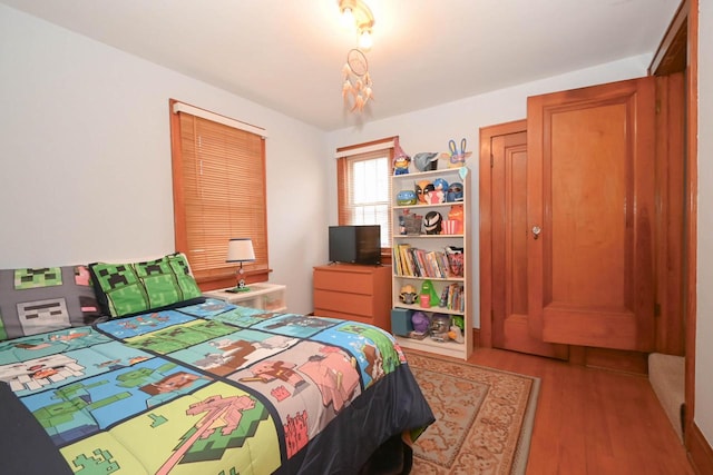 bedroom featuring wood finished floors