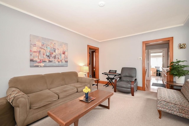 living room with light carpet, crown molding, and baseboards