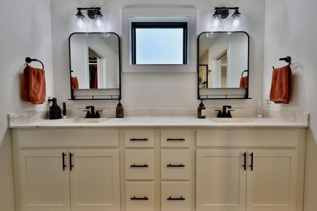 full bath with double vanity and a sink