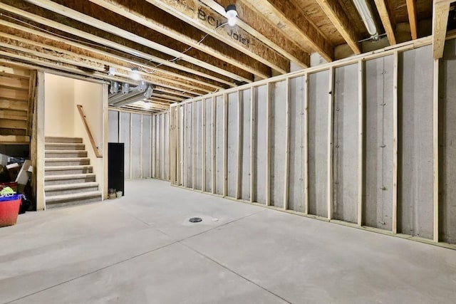 unfinished basement with stairway
