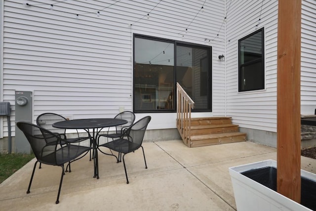 view of patio featuring outdoor dining area