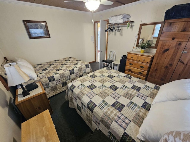 carpeted bedroom featuring a ceiling fan and ornamental molding