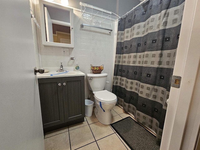 full bath with tile patterned flooring, toilet, vanity, a shower with curtain, and tile walls