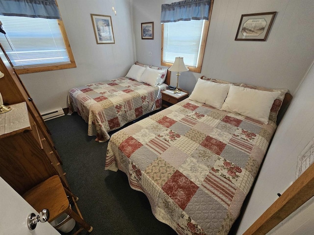 bedroom with a baseboard radiator and carpet flooring