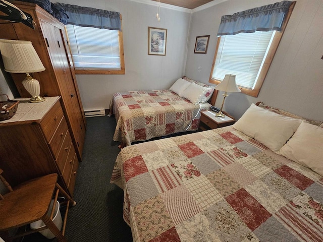 carpeted bedroom with baseboard heating and ornamental molding