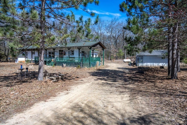 1142 Fawn Ct, Grand Marsh, WI 53936 - view of front of house with a porch and dirt driveway