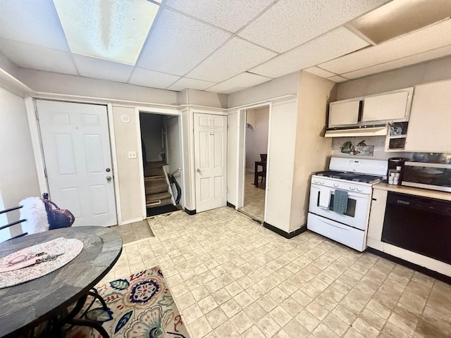 kitchen with stainless steel microwave, white range with gas cooktop, dishwasher, light countertops, and under cabinet range hood