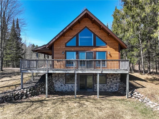 5044 Clayton Rd, Winter, WI 54896 - back of property featuring stone siding, a wooden deck, and log veneer siding
