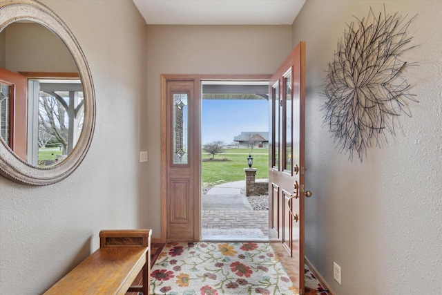 2555 W Deer Path Trl, Janesville, WI 53545 - foyer featuring a textured wall and baseboards