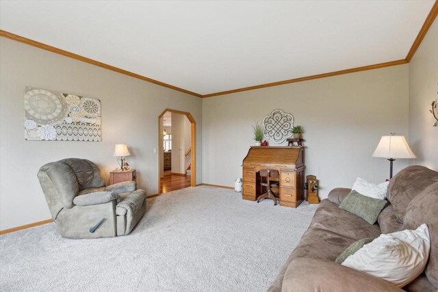 2555 W Deer Path Trl, Janesville, WI 53545 - carpeted living area featuring arched walkways, crown molding, and baseboards