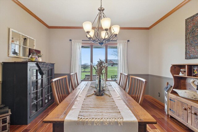 2555 W Deer Path Trl, Janesville, WI 53545 - dining area with hardwood / wood-style floors, ornamental molding, baseboards, and a notable chandelier