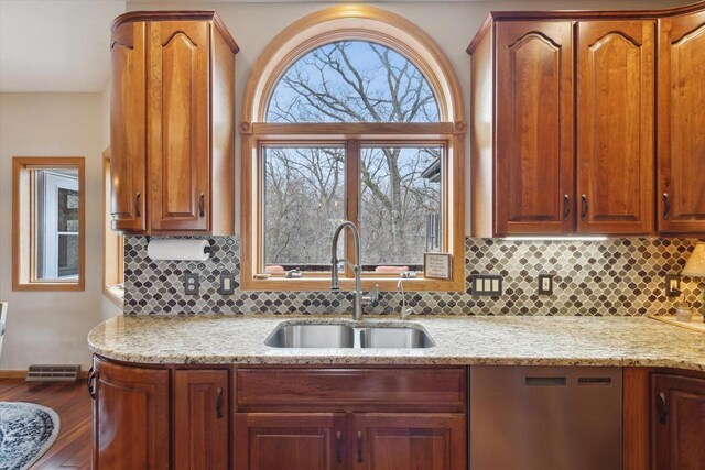 2555 W Deer Path Trl, Janesville, WI 53545 - kitchen with tasteful backsplash, dishwasher, light stone counters, and a sink