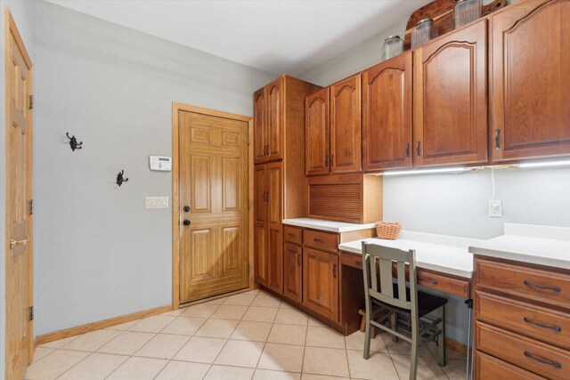 2555 W Deer Path Trl, Janesville, WI 53545 - office space with built in study area and light tile patterned floors