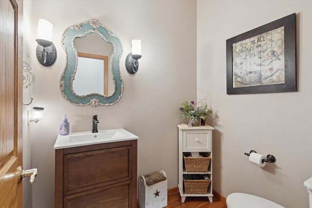 2555 W Deer Path Trl, Janesville, WI 53545 - half bath with toilet, vanity, and wood finished floors