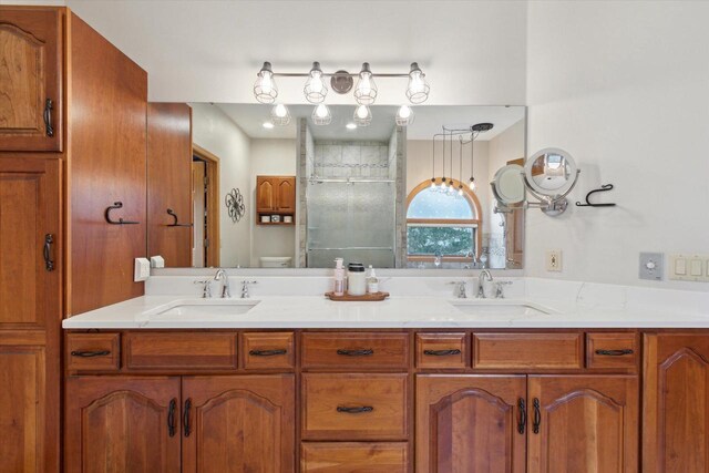 2555 W Deer Path Trl, Janesville, WI 53545 - full bathroom with a sink, a shower stall, double vanity, and toilet