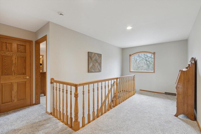 2555 W Deer Path Trl, Janesville, WI 53545 - hallway featuring an upstairs landing, baseboards, carpet flooring, visible vents, and recessed lighting