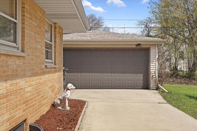 garage with concrete driveway