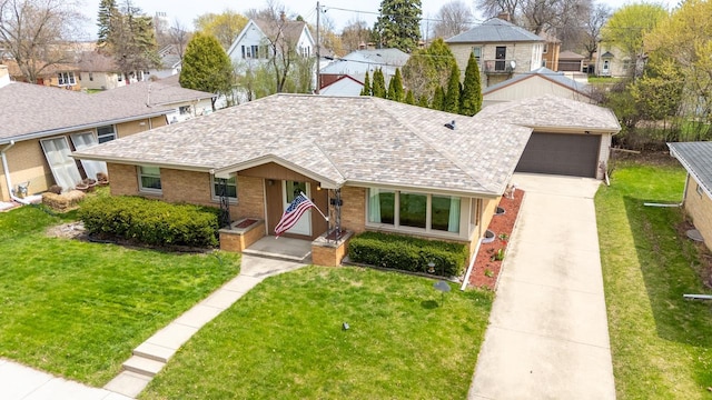 view of front facade featuring brick siding, roof with shingles, a front yard, and a residential view