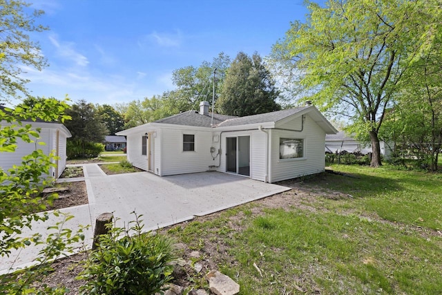 W160N9696 Colonial Dr, Germantown, WI 53022 - back of house featuring a patio area and a yard
