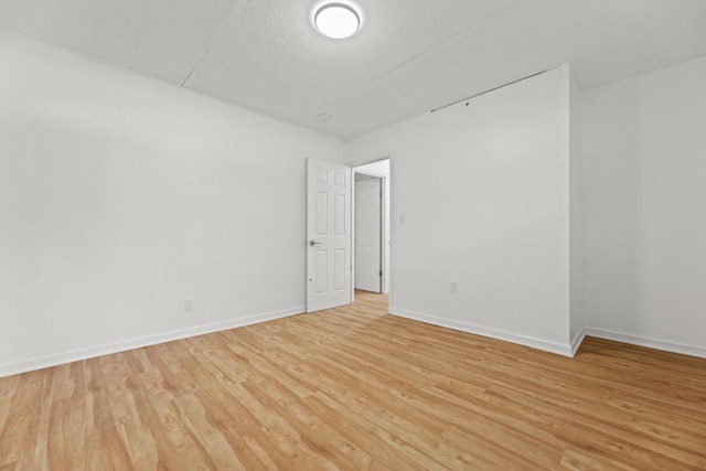 W160N9696 Colonial Dr, Germantown, WI 53022 - empty room featuring light wood-type flooring and baseboards
