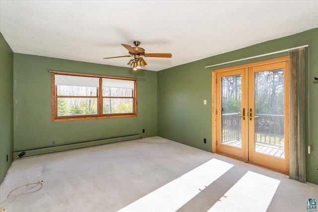 2608 Logan Ave, Superior, WI 54880 - carpeted empty room featuring baseboard heating, ceiling fan, and french doors