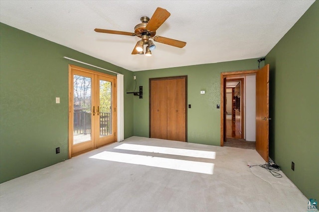 2608 Logan Ave, Superior, WI 54880 - spare room featuring carpet floors, a ceiling fan, and french doors