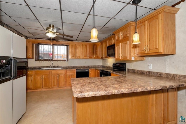 2608 Logan Ave, Superior, WI 54880 - kitchen featuring a ceiling fan, a sink, pendant lighting, black appliances, and a peninsula