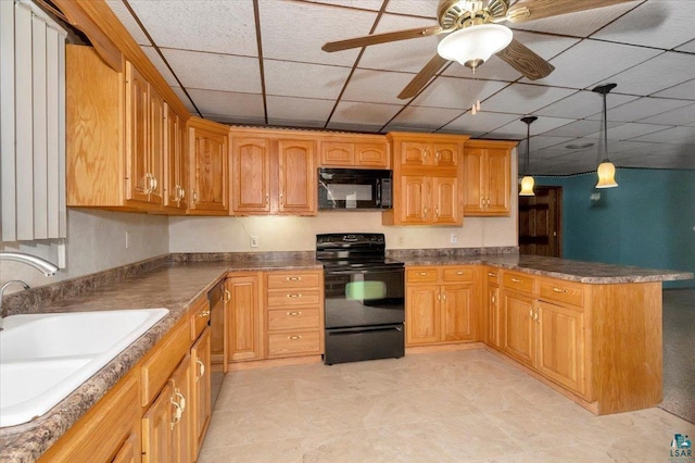 2608 Logan Ave, Superior, WI 54880 - kitchen featuring a peninsula, a sink, a drop ceiling, pendant lighting, and black appliances