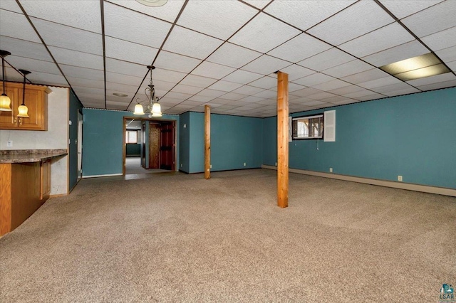 2608 Logan Ave, Superior, WI 54880 - below grade area featuring carpet, baseboards, and a paneled ceiling