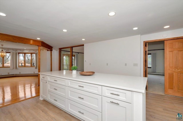 2608 Logan Ave, Superior, WI 54880 - kitchen with recessed lighting, light wood-style floors, and white cabinets