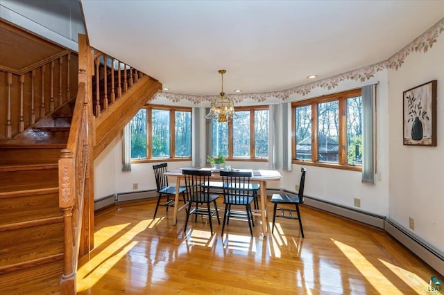2608 Logan Ave, Superior, WI 54880 - dining area featuring a chandelier, stairway, light wood-type flooring, and recessed lighting