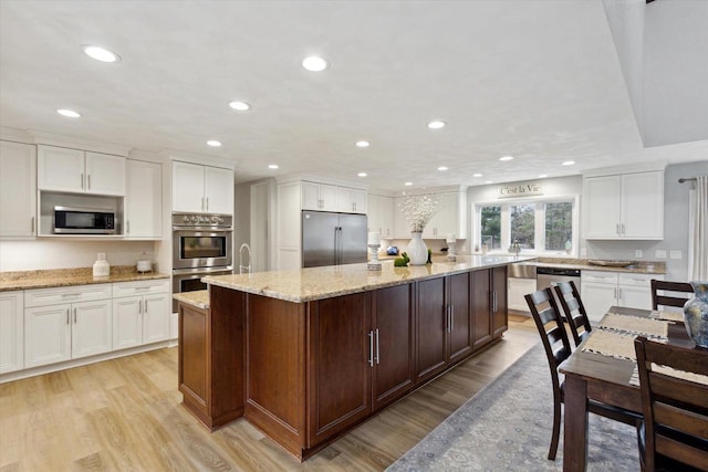 4441 N John Paul Rd, Milton, WI 53546 - kitchen with a center island, stainless steel appliances, light wood finished floors, and recessed lighting