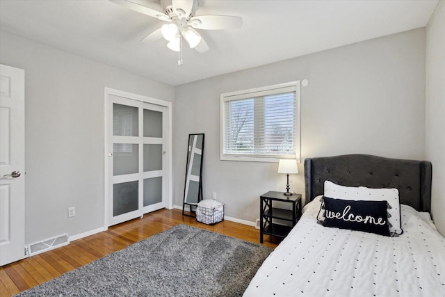 4441 N John Paul Rd, Milton, WI 53546 - bedroom with visible vents, ceiling fan, wood finished floors, and baseboards
