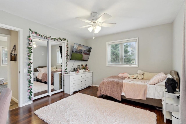 4441 N John Paul Rd, Milton, WI 53546 - bedroom with dark wood finished floors, baseboards, and ceiling fan