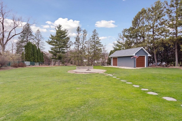 4441 N John Paul Rd, Milton, WI 53546 - view of yard featuring a detached garage and an outbuilding