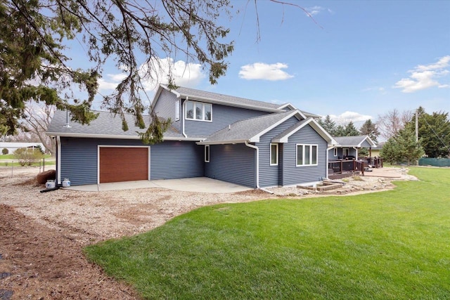 4441 N John Paul Rd, Milton, WI 53546 - exterior space with a shingled roof, a patio area, a lawn, driveway, and an attached garage