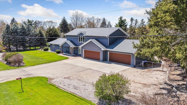 4441 N John Paul Rd, Milton, WI 53546 - traditional-style house with concrete driveway, covered porch, a front yard, fence, and a garage