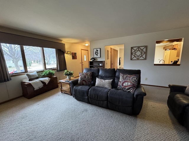living room with baseboards and carpet flooring
