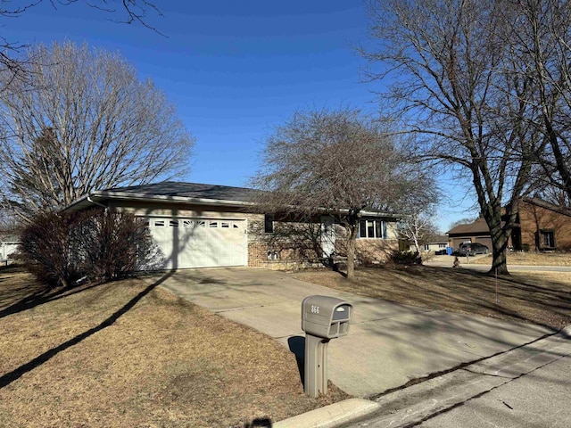 view of front of home with an attached garage and driveway