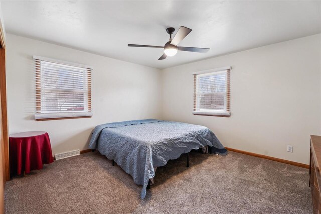 W5184 Shady Ln, Shawano, WI 54166 - carpeted bedroom with visible vents, a ceiling fan, and baseboards