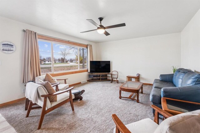 W5184 Shady Ln, Shawano, WI 54166 - living area featuring baseboards, ceiling fan, and light colored carpet