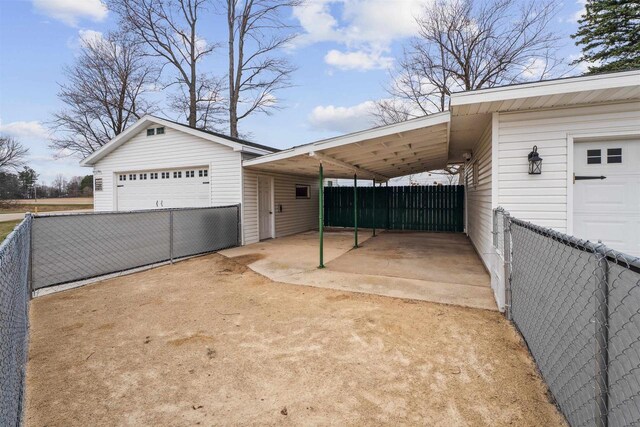 W5184 Shady Ln, Shawano, WI 54166 - view of side of home with a detached garage and fence