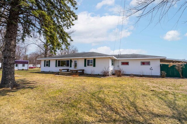 W5184 Shady Ln, Shawano, WI 54166 - back of property featuring an outdoor structure, a yard, and fence