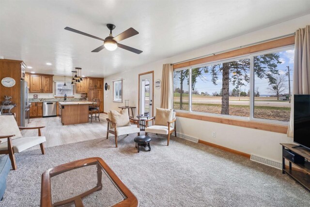 W5184 Shady Ln, Shawano, WI 54166 - living room featuring recessed lighting, visible vents, a ceiling fan, baseboards, and light colored carpet