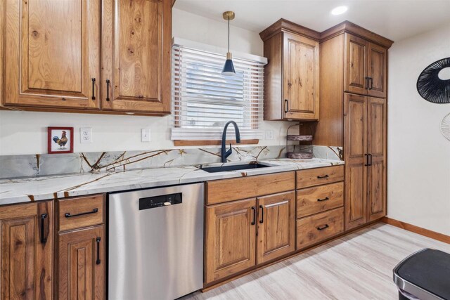 W5184 Shady Ln, Shawano, WI 54166 - kitchen with brown cabinets, dishwasher, light wood finished floors, and a sink