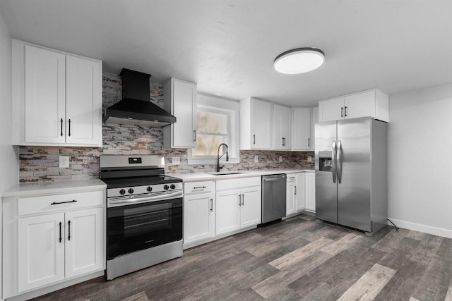 N5599 Mill St, Shiocton, WI 54170 - kitchen featuring wall chimney exhaust hood, stainless steel appliances, a sink, dark wood finished floors, and backsplash